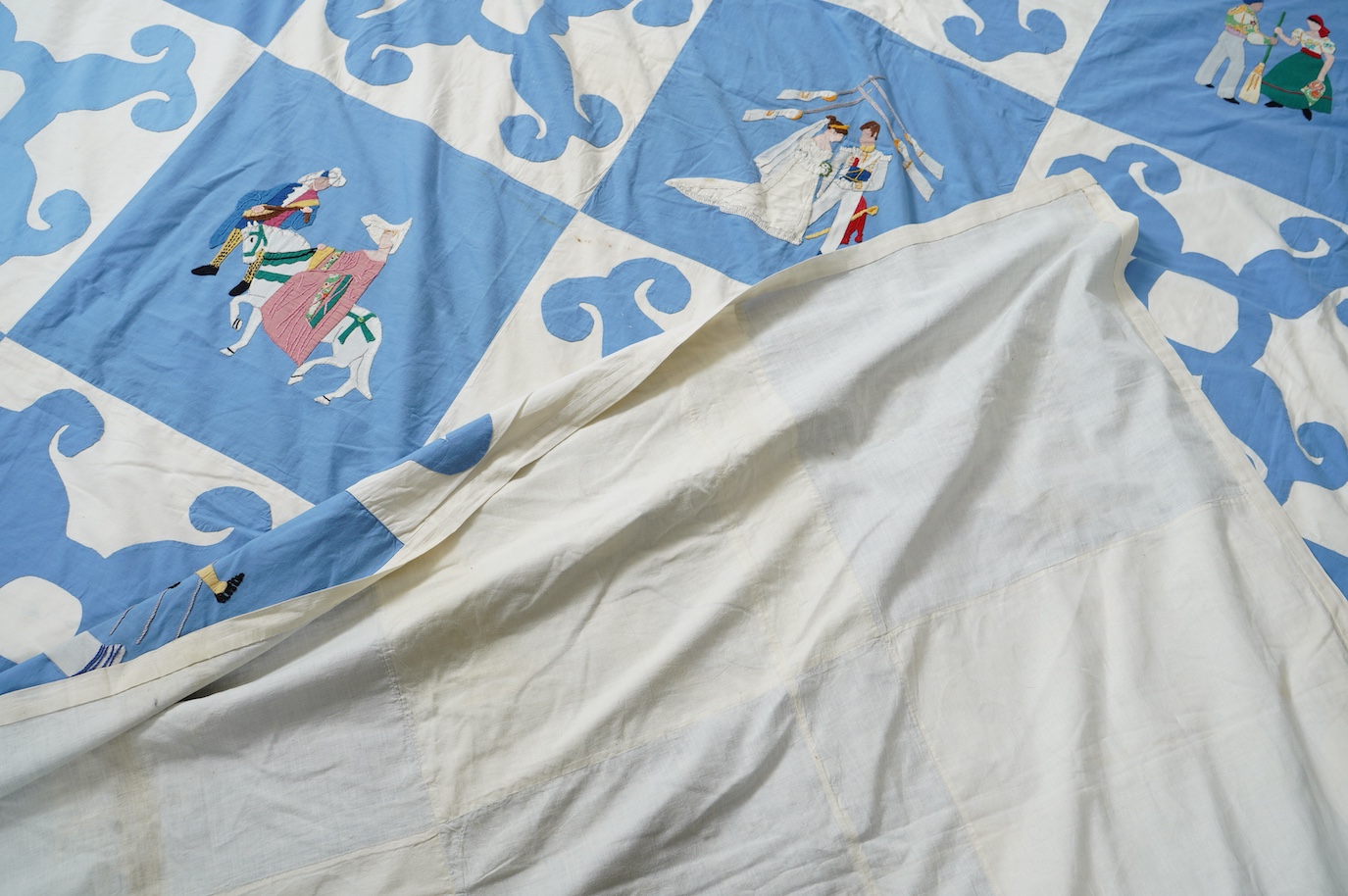 A rare figurative American ‘bridal quilt coverlet’, designed by Marion Cheever Whiteside Newton, whose designs were originally widely published in magazines and sold during the 1940’s-50’s. Her ‘quilting kits’ were also